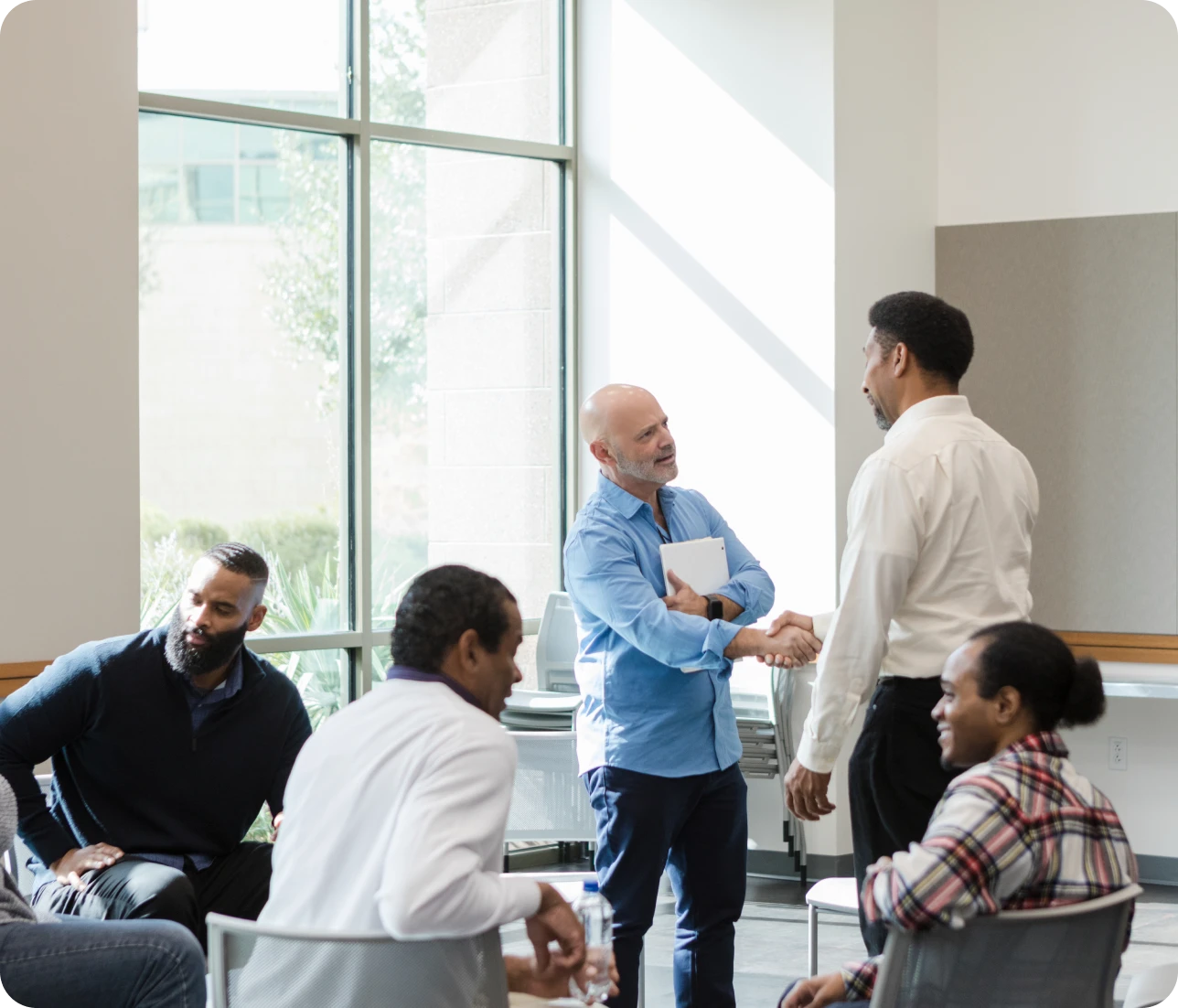 Group meeting with handshake